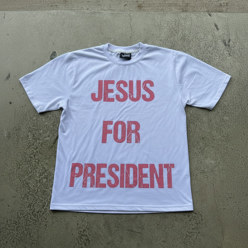 Front of white Jesus For President shirt with pink lettering